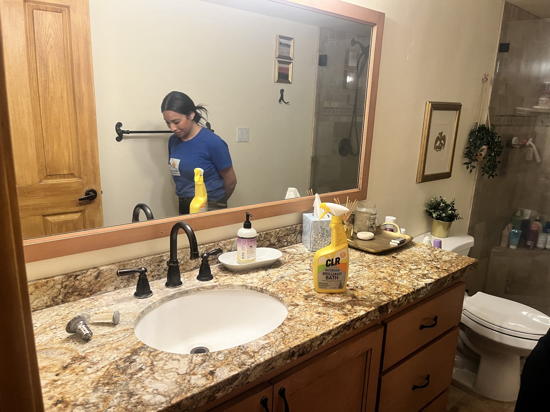 Sun Ray team member cleaning a bathroom